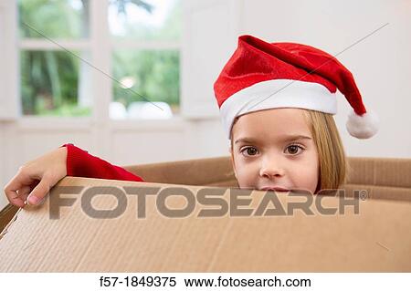 Four year old girl playing in a cardboard box at Christmas View Large Photo Image Stock Photography - Four year old girl playing in a cardboard box at Christmas. Fotosearch