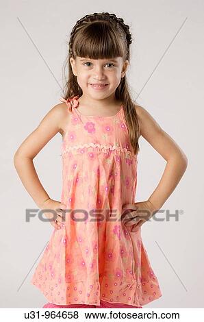 Four year old girl smiling at the camera View Large Photo Image Stock Photo - Four year old girl smiling at the camera. Fotosearch