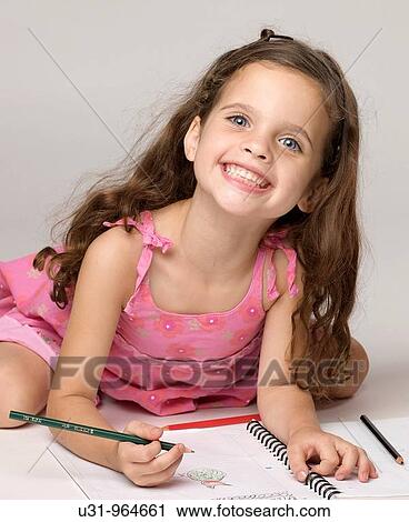 Four year old girl smiling at the camera ready to do homework View Large Photo Image Stock Image - Four year old girl smiling at the camera ready to do homework. Fotosearch