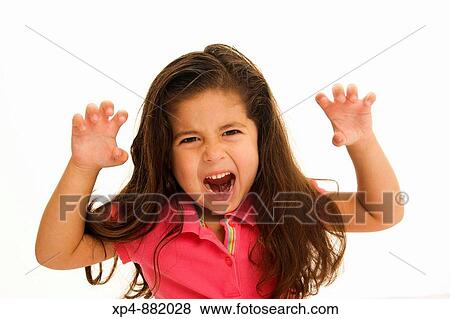 Four year old girl with long brown hair in pink top. She has both arms raised to the sides of her head, her hands at formed like claws she frowls at the camera. View Large Photo Image Stock Photo - Four year old girl with long brown hair in pink top. She has both arms raised to the sides of her head, her hands at formed like claws she frowls at the camera.. Fotosearch