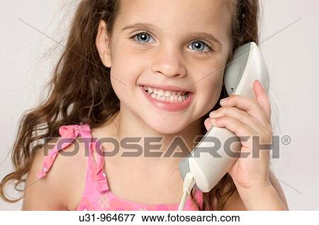 Four year old twins talking on the phone View Large Photo Image Stock Photo - Four year old twins talking on the phone. Fotosearch