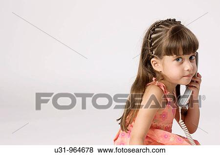 Stock Photo - Four year old twins talking on the phone. Fotosearch