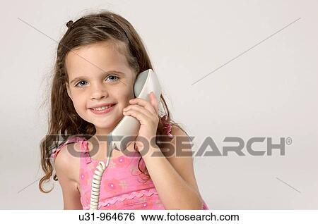 Stock Photograph - Four year old twins talking on the phone. Fotosearch