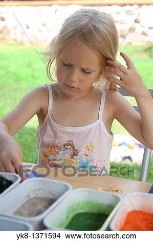 Picture - Four Year Old Young Kid Girl Working with Color Sand in Art Class. Fotosearch