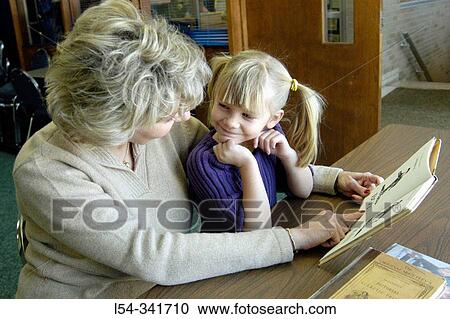 Four years old girl learns to read with McGuffey's reading books. View Large Photo Image Stock Image - Four years old girl learns to read with McGuffey's reading books.. Fotosearch
