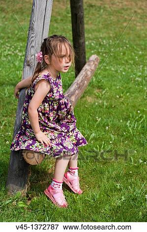 Four years old girl playing outside. View Large Photo Image Stock Photo - Four years old girl playing outside.. Fotosearch