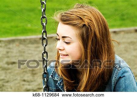 Fourteen year old girl in a playground in Vancouver, BC, Canada View Large Photo Image Picture - Fourteen year old girl in a playground in Vancouver, BC, Canada. Fotosearch