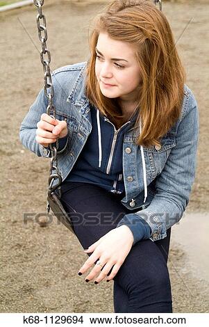 Fourteen year old girl in a playground in Vancouver, BC, Canada View Large Photo Image Picture - Fourteen year old girl in a playground in Vancouver, BC, Canada. Fotosearch