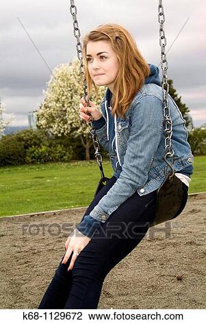 Fourteen year old girl in a playground in Vancouver, BC, Canada View Large Photo Image Stock Image - Fourteen year old girl in a playground in Vancouver, BC, Canada. Fotosearch