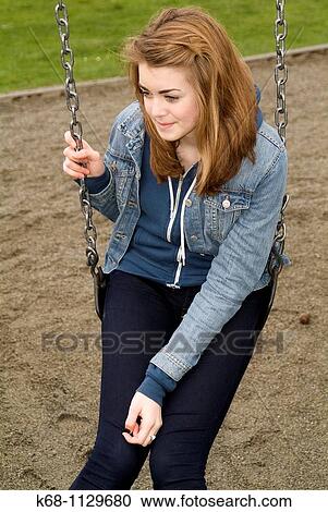 Fourteen year old girl in a playground in Vancouver, BC, Canada View Large Photo Image Stock Image - Fourteen year old girl in a playground in Vancouver, BC, Canada. Fotosearch