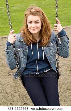 Fourteen year old girl in a playground in Vancouver, BC, Canada View Large Photo Image Stock Photo - Fourteen year old girl in a playground in Vancouver, BC, Canada. Fotosearch