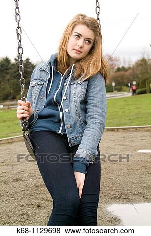 Fourteen year old girl in a playground in Vancouver, BC, Canada View Large Photo Image Stock Photo - Fourteen year old girl in a playground in Vancouver, BC, Canada. Fotosearch