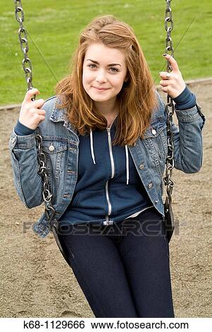 Fourteen year old girl in a playground in Vancouver, BC, Canada View Large Photo Image Stock Photograph - Fourteen year old girl in a playground in Vancouver, BC, Canada. Fotosearch