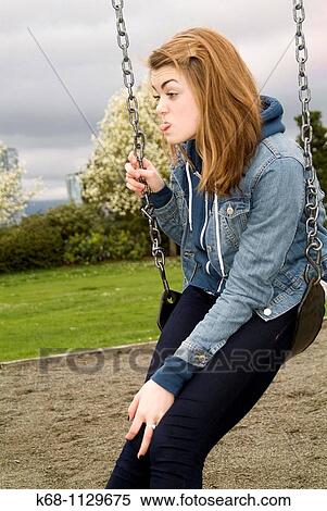Fourteen year old girl in a playground in Vancouver, BC, Canada View Large Photo Image Stock Photography - Fourteen year old girl in a playground in Vancouver, BC, Canada. Fotosearch