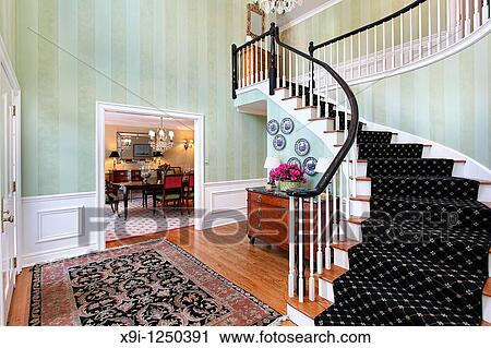 Foyer in luxury home with carpeted staircase View Large Photo Image Stock Image - Foyer in luxury home with carpeted staircase. Fotosearch