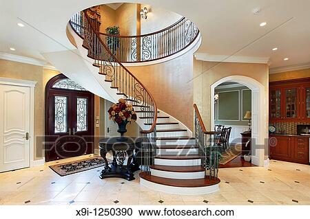 Foyer in luxury home with circular staircase View Large Photo Image Stock Image - Foyer in luxury home with circular staircase. Fotosearch