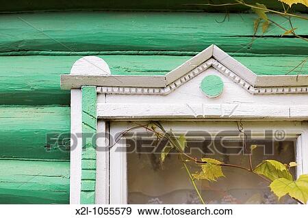 Fragment of window decoration of a wooden country house Russia View Large Photo Image Stock Photo - Fragment of window decoration of a wooden country house Russia. Fotosearch