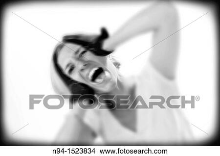 Framed photograph or vignettes of a young woman desperate cry, the edge of madness. View Large Photo Image Picture - Framed photograph or vignettes of a young woman desperate cry, the edge of madness.. Fotosearch