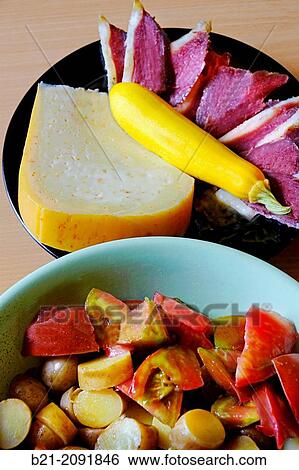 France. Aquitaine. Dordogne. Food. Tomatoes and Potetoes salad, with Onion cheese and "Magret s? ch? de canard". View Large Photo Image Stock Photograph - France. Aquitaine. Dordogne. Food. Tomatoes and Potetoes salad, with Onion cheese and "Magret s? ch? de canard".. Fotosearch