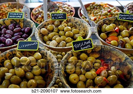 Stock Photo - France. Aquitaine. Gironde-different kinds of cured olives on the Bastide plaza of Sainte Foy la Grande.. Fotosearch