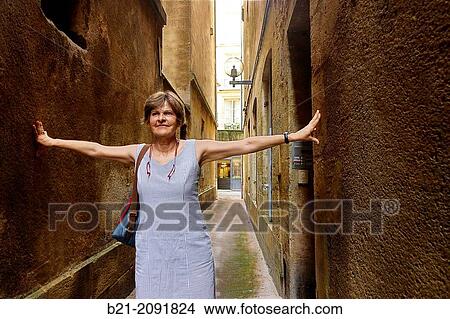 Picture - France. Aquitaine. Gironde. "Rue de la Vache", the most narrow Middle Age street in the old Bordeaux.. Fotosearch