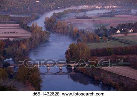 France, Aquitaine Region, Dordogne Department, Domme, elevated view of the Dordogne River Valley in fog from the Belvedere de la Barre, dawn View Large Photo Image Stock Photo - France, Aquitaine Region, Dordogne Department, Domme, elevated view of the Dordogne River Valley in fog from the Belvedere de la Barre, dawn. Fotosearch