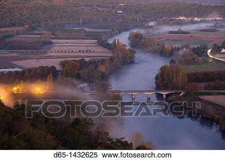 France, Aquitaine Region, Dordogne Department, Domme, elevated view of the Dordogne River Valley in fog from the Belvedere de la Barre, dawn View Large Photo Image Stock Photography - France, Aquitaine Region, Dordogne Department, Domme, elevated view of the Dordogne River Valley in fog from the Belvedere de la Barre, dawn. Fotosearch
