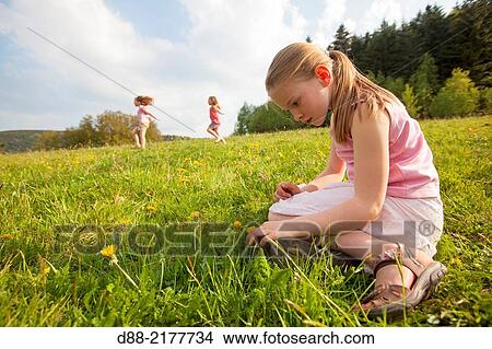France, Bas Rhin, Urbeis near the Climont, girl in a meadow. View Large Photo Image Picture - France, Bas Rhin, Urbeis near the Climont, girl in a meadow.. Fotosearch