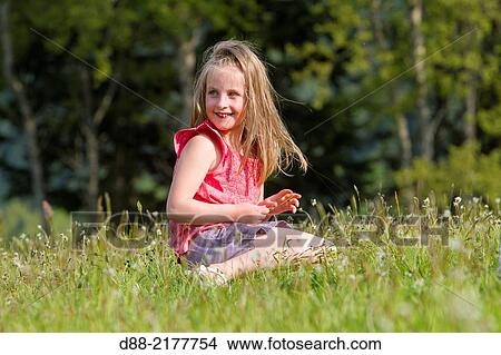 France, Bas Rhin, Urbeis near the Climont, girl in a meadow. View Large Photo Image Picture - France, Bas Rhin, Urbeis near the Climont, girl in a meadow.. Fotosearch