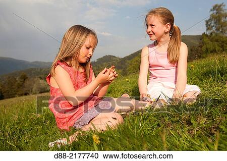 France, Bas Rhin, Urbeis near the Climont, girls in a meadow. View Large Photo Image Stock Image - France, Bas Rhin, Urbeis near the Climont, girls in a meadow.. Fotosearch