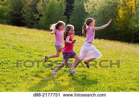 France, Bas Rhin, Urbeis near the Climont, girls in a meadow. View Large Photo Image Stock Image - France, Bas Rhin, Urbeis near the Climont, girls in a meadow.. Fotosearch