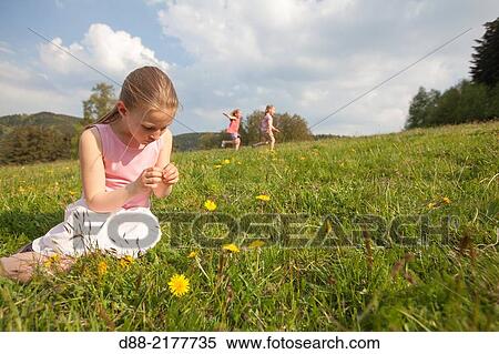 France, Bas Rhin, Urbeis near the Climont, girl in a meadow. View Large Photo Image Stock Photography - France, Bas Rhin, Urbeis near the Climont, girl in a meadow.. Fotosearch