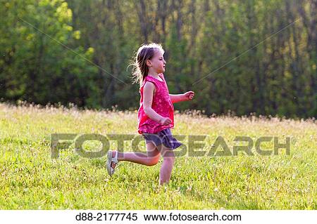 France, Bas Rhin, Urbeis near the Climont, girl in a meadow. View Large Photo Image Stock Photography - France, Bas Rhin, Urbeis near the Climont, girl in a meadow.. Fotosearch