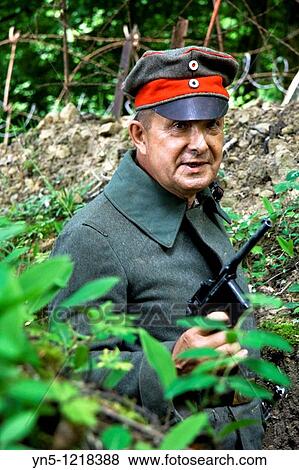 Stock Photo - France, Champagne-Ardenne, Marne 51, Vienne le Chateau - Camp de la Vall? e Moreau - recontitution and remnants of a german camp of the First Worl War - German soldier in uniform. Fotosearch