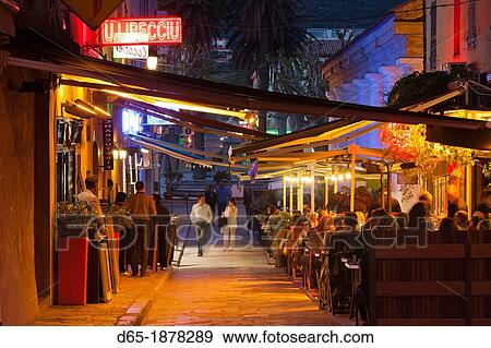 France, Corsica, Haute-Corse Department, La Balagne Region, Ile Rousse, outdoor cafes, dusk, NR View Large Photo Image Stock Photo - France, Corsica, Haute-Corse Department, La Balagne Region, Ile Rousse, outdoor cafes, dusk, NR. Fotosearch