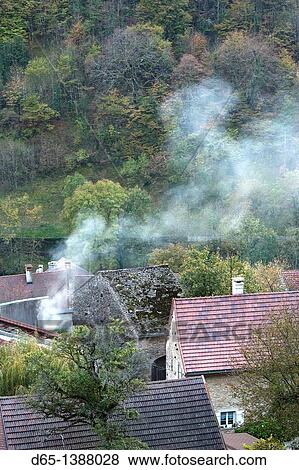Stock Photo - France, Jura Department, Franche-Comte Region, Les Reculees valley area, Baume-les-Messieurs, village view, late afternoon. Fotosearch