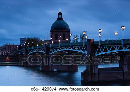 Picture - France, Midi-Pyrenees Region, Haute-Garonne Department, Toulouse, Pont St-Pierre bridge and the dome of the Hopital de la Grave, evening. Fotosearch