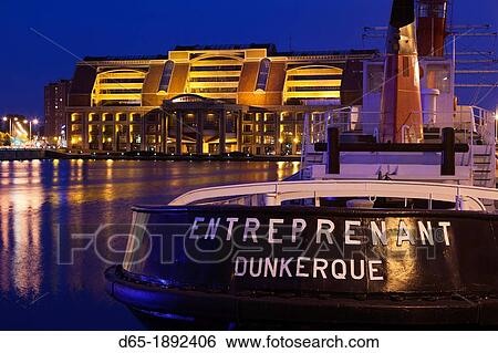 France, Nord-Pas de Calais Region, Nord Department, French Flanders Area, Dunkerque, tugboat and Comunaute Urbaine building, dusk View Large Photo Image Stock Photograph - France, Nord-Pas de Calais Region, Nord Department, French Flanders Area, Dunkerque, tugboat and Comunaute Urbaine building, dusk. Fotosearch