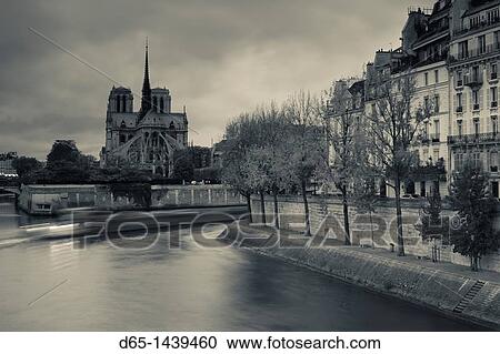 Stock Image - France, Paris, Cathedral Notre Dame cathedral and Ile St-Louis, dawn. Fotosearch