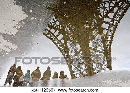 France, Paris reflection of the Eiffel tower in a water puddle View Large Photo Image Stock Photo - France, Paris reflection of the Eiffel tower in a water puddle. Fotosearch