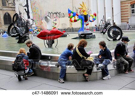 Stock Image - France, Paris, The Stravinsky Fountain located in Place Stravinsky, between the Centre Pompidou and the Church of Saint-Merri.. Fotosearch