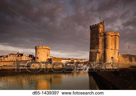 France, Poitou-Charentes Region, Charente-Maritime Department, La Rochelle, Old Port, Tour de la Chaine and Tour St-Nicholas towers, dawn View Large Photo Image Stock Photo - France, Poitou-Charentes Region, Charente-Maritime Department, La Rochelle, Old Port, Tour de la Chaine and Tour St-Nicholas towers, dawn. Fotosearch