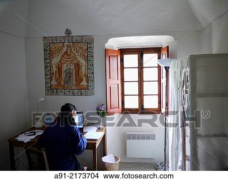 France, Provence, Alpes Maritimes (06), Saorge, the franciscan monastery, public monument accomodating writers for writing retreats, writer at work View Large Photo Image Picture - France, Provence, Alpes Maritimes (06), Saorge, the franciscan monastery, public monument accomodating writers for writing retreats, writer at work. Fotosearch