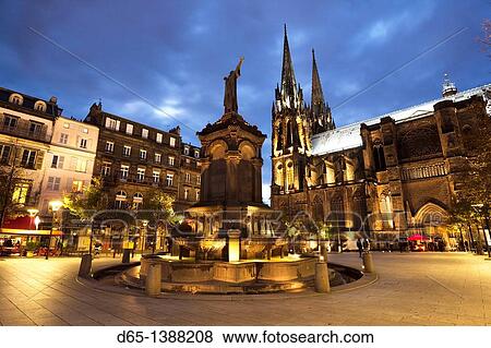 Stock Photo - France, Puy-de-Dome Department, Auvergne Region, Clermont-Ferrand, Place de la Victoire, Cathedrale-Notre-Dame, evening. Fotosearch