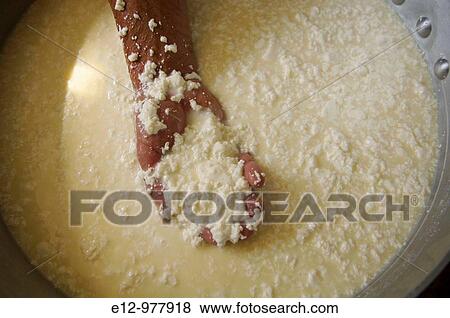 France, Pyrenees mounts, Pyrenees-Atlantic department, Aspe valley, Shepherd & cheese producer Jean Marie Boyer warming curdled milk, and putting it in moults. View Large Photo Image Stock Photo - France, Pyrenees mounts, Pyrenees-Atlantic department, Aspe valley, Shepherd & cheese producer Jean Marie Boyer warming curdled milk, and putting it in moults.. Fotosearch
