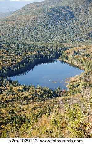 Franconia Notch State Park - Lonesome Lake from Hi-Cannon Trail This trail leads to the summit of Cannon Mountain in the White Mountains, New Hampshire USA View Large Photo Image Stock Image - Franconia Notch State Park - Lonesome Lake from Hi-Cannon Trail This trail leads to the summit of Cannon Mountain in the White Mountains, New Hampshire USA. Fotosearch