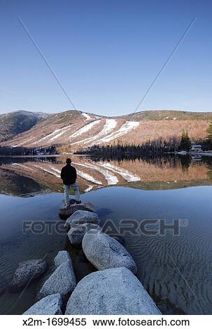 Stock Photography - Franconia Notch State Park - Relection of Cannon Mountain in Echo Lake during the spring months in the White Mountains, New Hampshire USA. Fotosearch