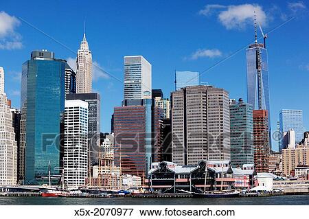 Freedom Tower rises above the Lower Manhattan skyline in New York city, USA. View Large Photo Image Stock Photo - Freedom Tower rises above the Lower Manhattan skyline in New York city, USA.. Fotosearch