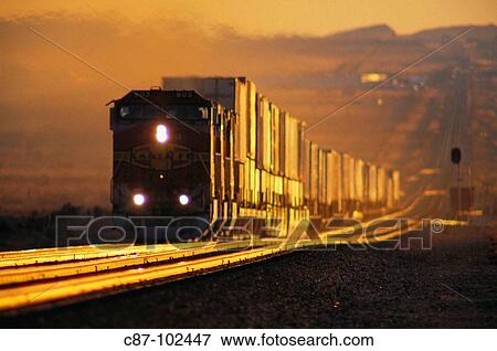 Freight train laboring up hill near Kingman, Arizona, USA View Large Photo Image Stock Photo - Freight train laboring up hill near Kingman, Arizona, USA. Fotosearch