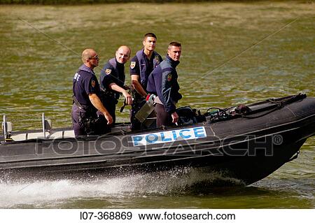 French policemen patrolling the Seine River in a boat. Paris. France View Large Photo Image Stock Photo - French policemen patrolling the Seine River in a boat. Paris. France. Fotosearch